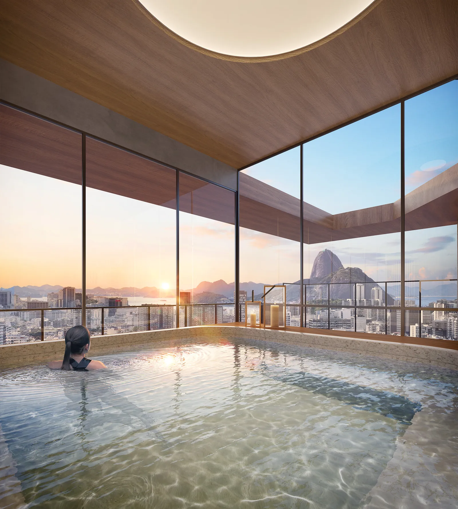 Bassin intérieur du spa de First Humaitá avec vue sur le coucher de soleil sur Rio